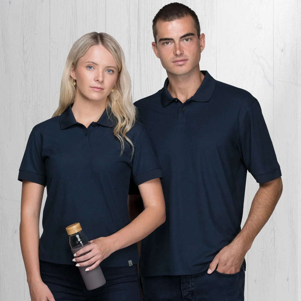Two people in navy blue polo shirts from Life Mens polos gear for urban and outdoor style