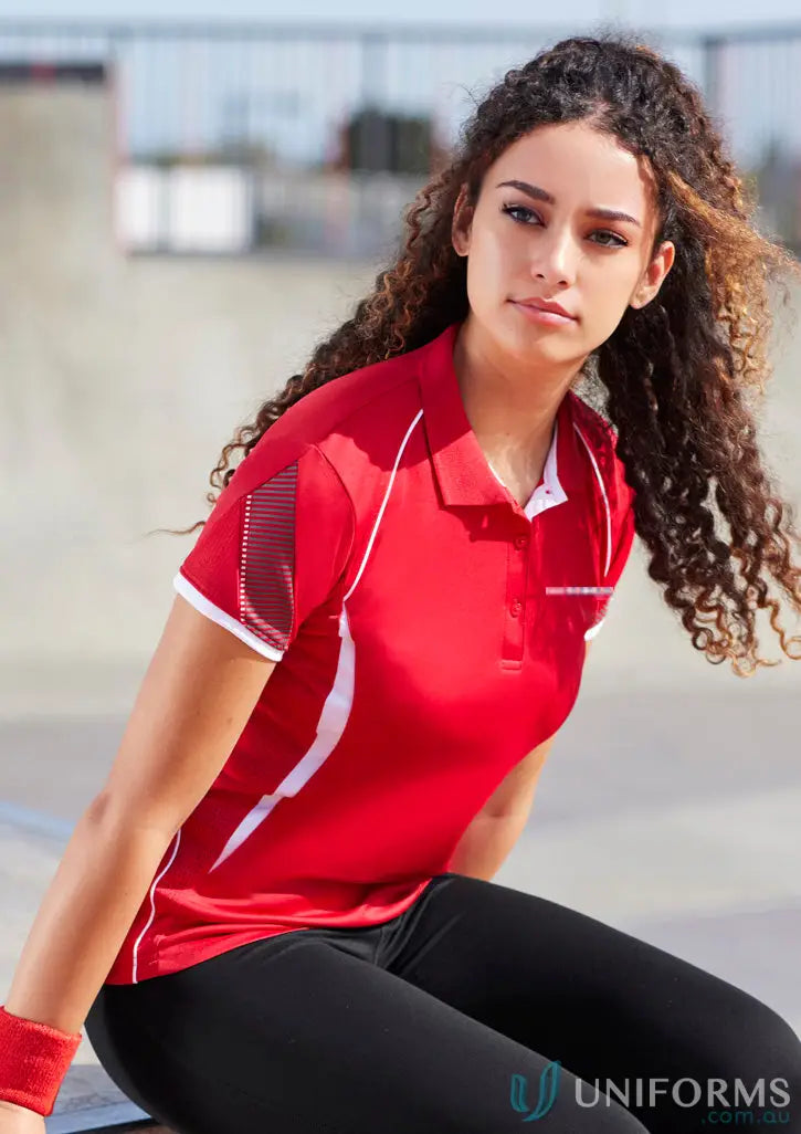 Lady in red ladies polo shirt with white accents, perfect for polyester sports uniforms