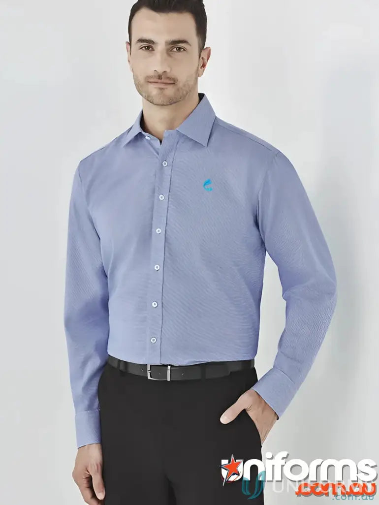 Man in FMIG EMB Mens Cotton LS Shirt with blue logo and black dress pants
