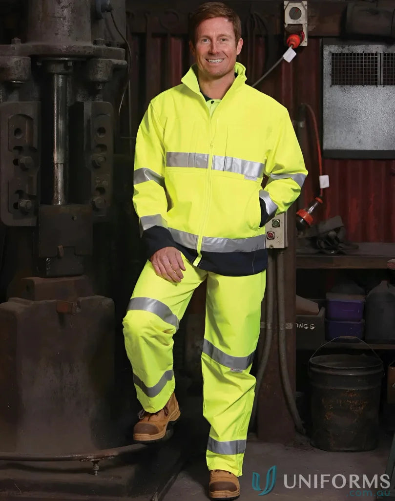 Man in HiVis Softshell Jacket With 3M Tape showcasing winning spirit and HiVis Softshell Jacket style