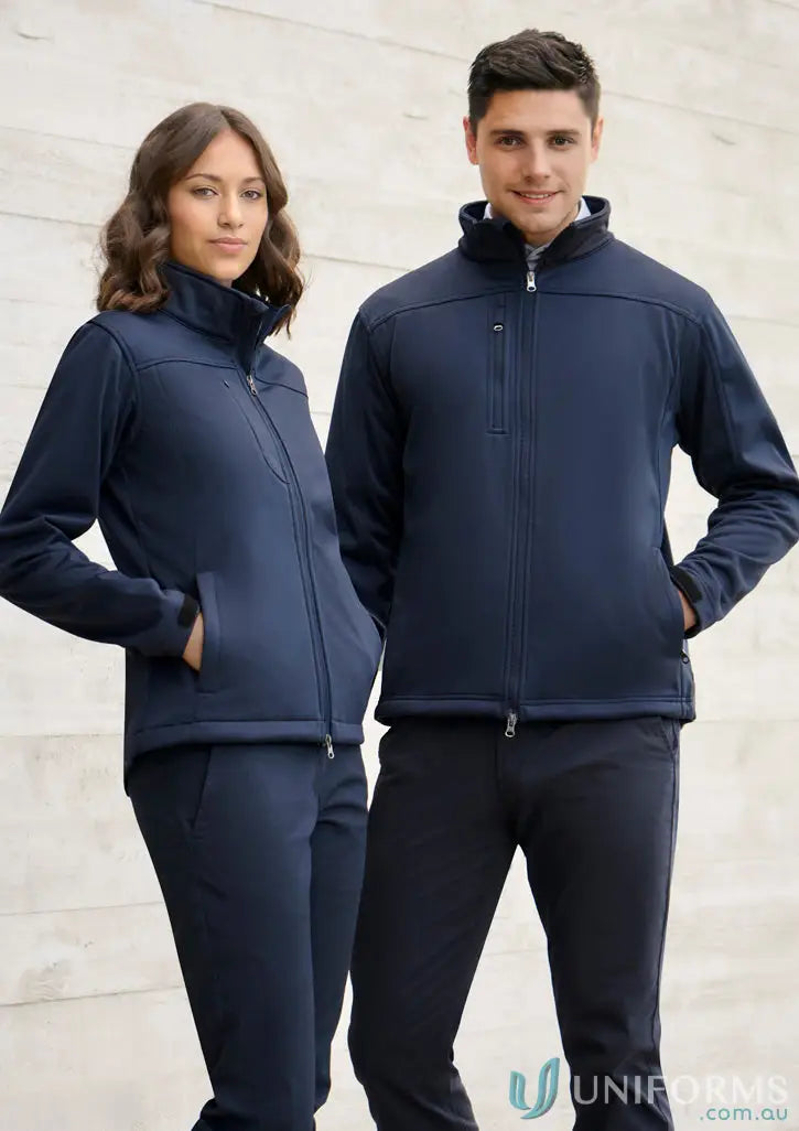 Two people in navy blue IOP EMB Ladies Soft Shell Jackets for sports activities