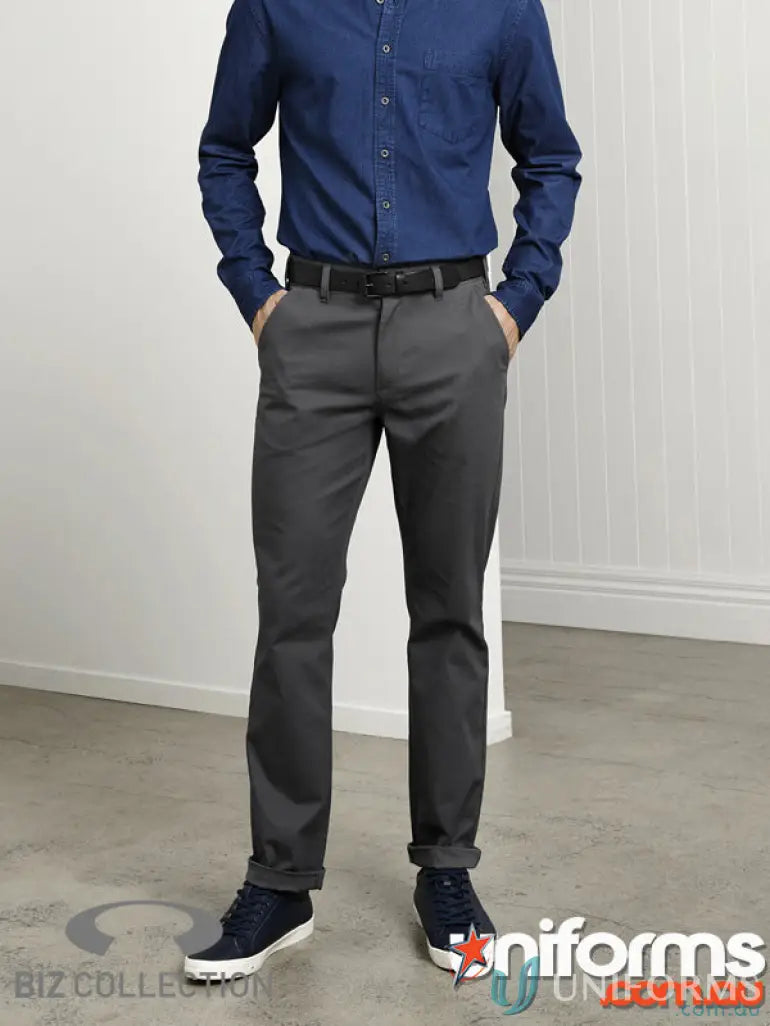 Man wearing blue shirt and gray pants showcasing IOP Stretch Chino Pants from Biz Collection Lawson BS724M