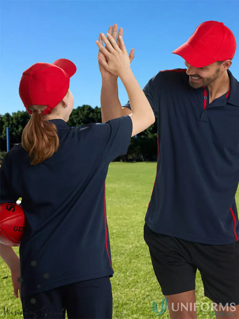 Two people high-fiving in matching navy and red MOQ25 Embroidered Caps made of heavy brushed cotton
