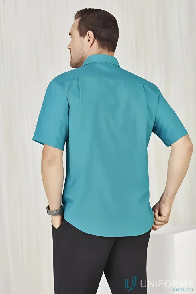 Man wearing teal Mens Oasis Short Sleeve Shirt showcasing the oasis shirt style