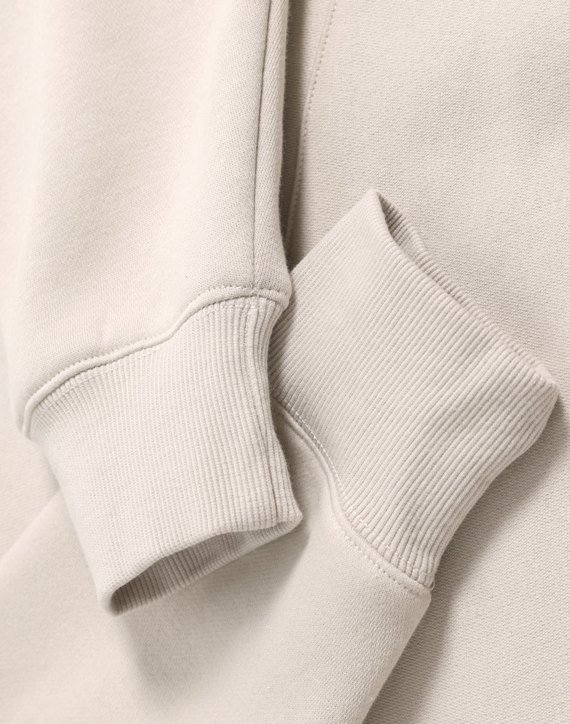 Cream-colored ribbed knit cuffs on a soft cotton premium oversized bone hoodie ideal for work uniforms and workwear
