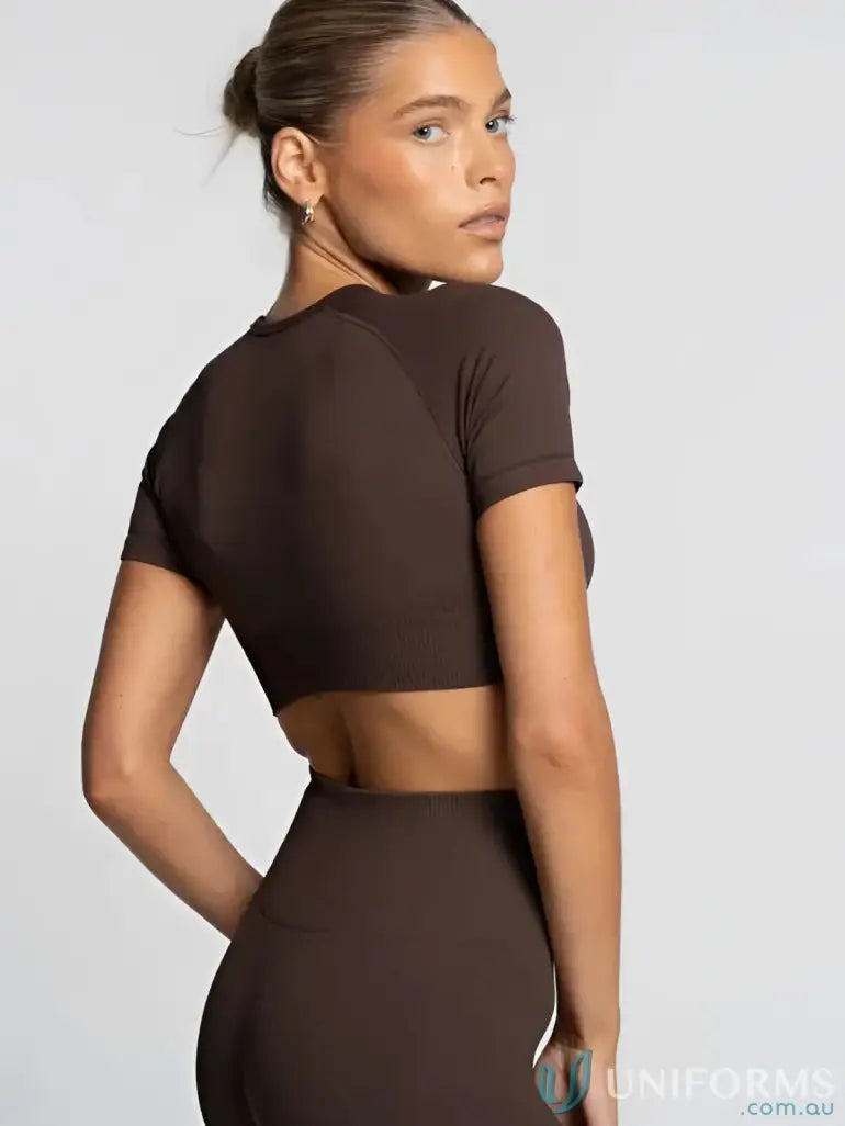Brown seamless cropped tee with back cutout and form fitting design perfect for workwear and uniforms