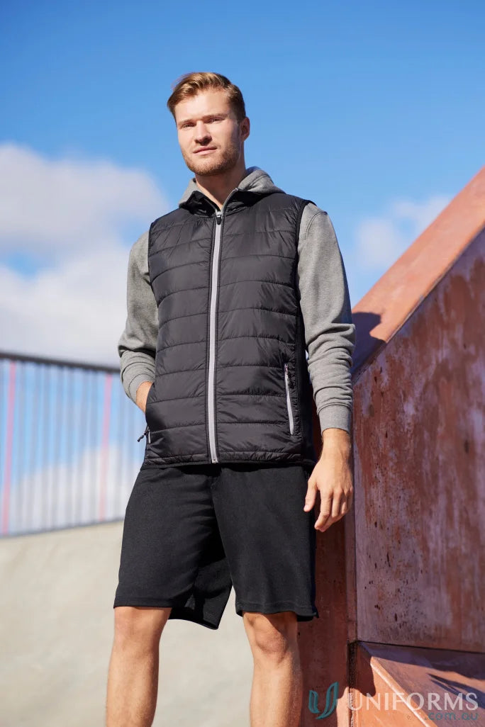 Man in black Stealth Vest featuring core warm PolyFil insulation, part of collection mens stealth