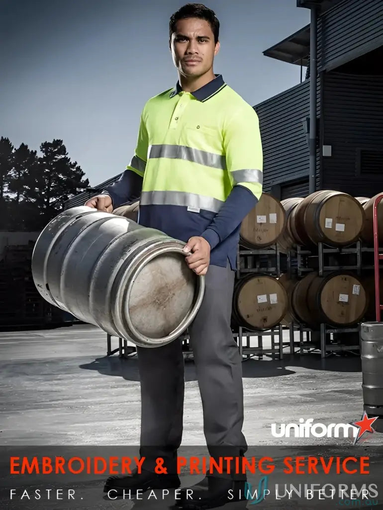 Man carrying a metal keg wearing Syzmik Mens Vis Spliced Long Hoop Taped work shirt