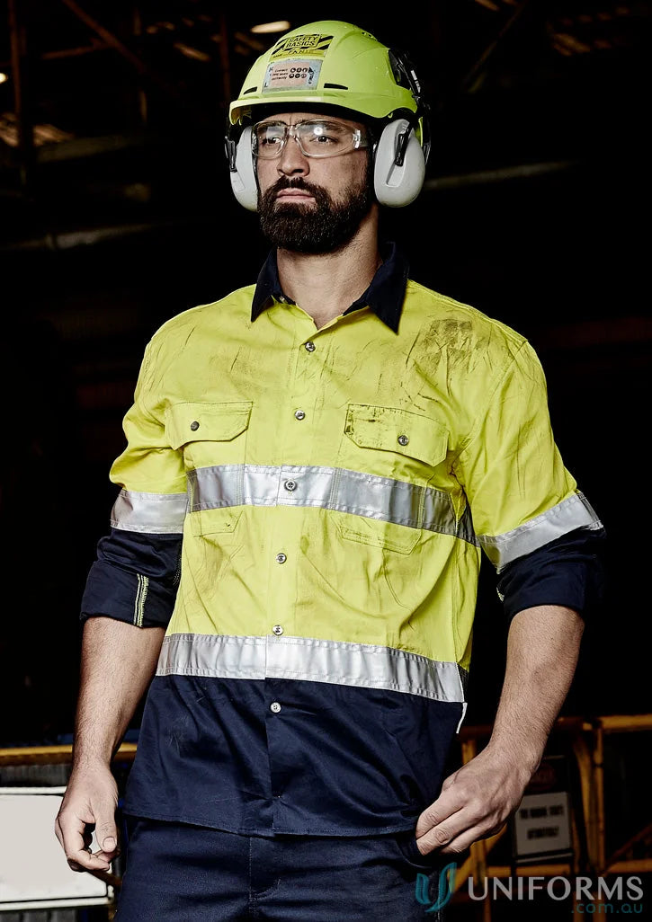 Man in safety gear wearing Syzmik Mens Industrial Long Sleeve Shirt Hoop Taped zw123 for demanding work environments