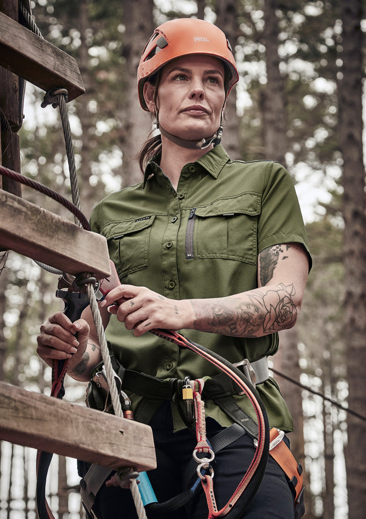Syzmik Outdoor Ladies orange POC climbing helmet on women’s outdoor short sleeve shirt