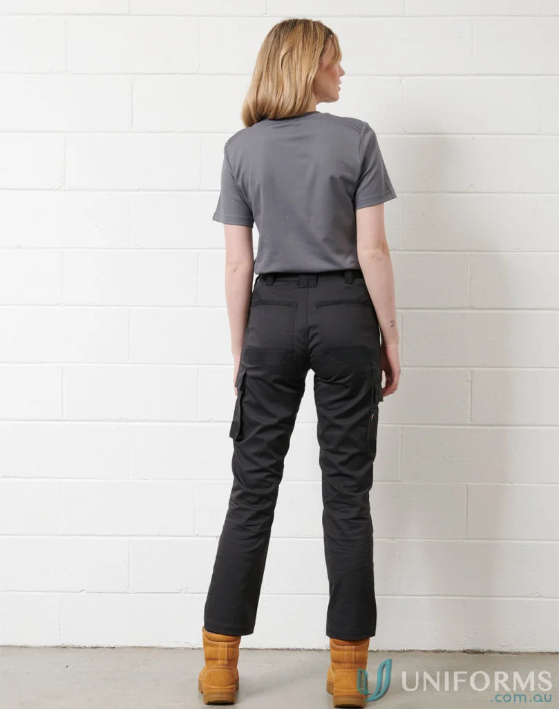 Women’s gray utility stretch cargo work pants with dark cargo work pants and tan boots