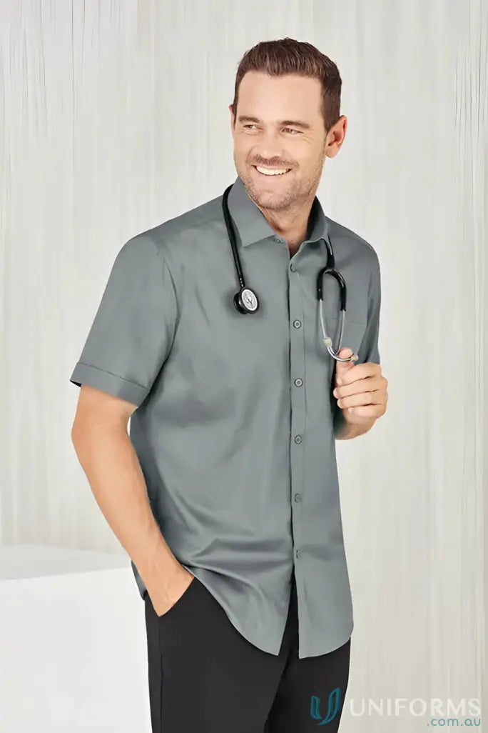 Smiling doctor in gray YR Mens EMB SS Shirt showcasing Monaco Short Sleeve Shirt offers
