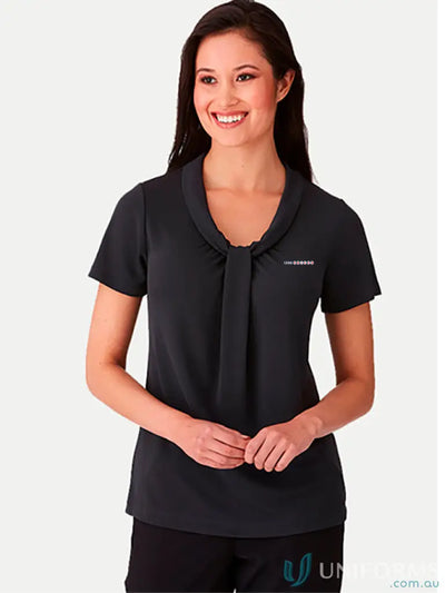 Woman in 1300 Practice Manager Trainee Ladies Top with soft draped neckline