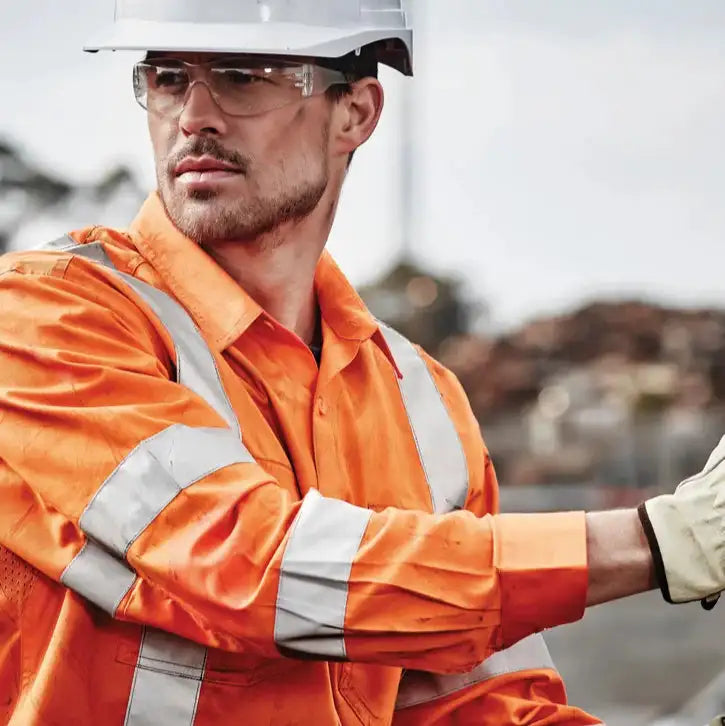 Workers wearing hi vis safety uniforms in Australia for trades and construction workwear on job sites