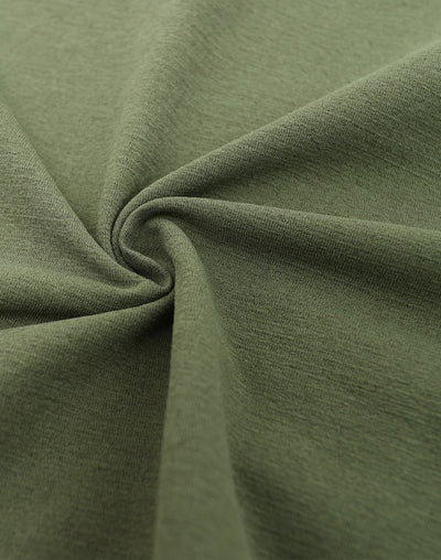 Close-up of green fabric with folds