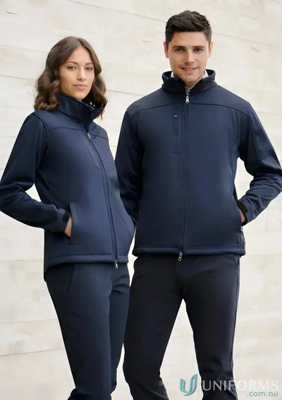 Man and woman in matching navy blue mens softshell jackets j3880 made with Biz Tech fabric