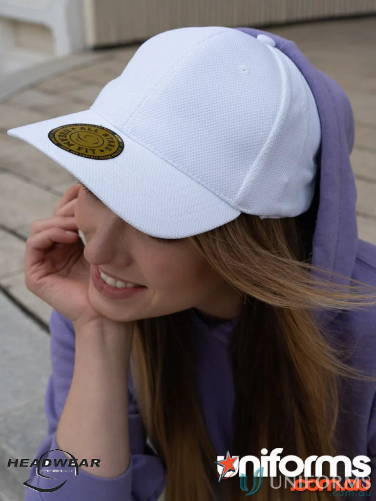 White textured fitted cap with gold emblem, perfect for uniforms and dream fit style