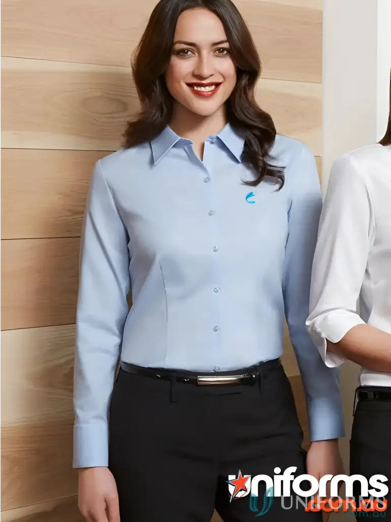 Woman wearing IOP Ladies Premium Cotton LS Shirt in light blue with mini herringbone pattern