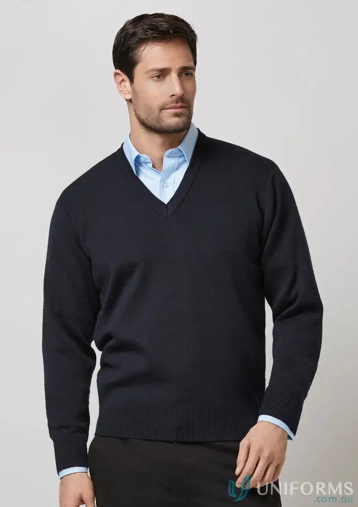 Man in navy blue V-neck sweater over light blue shirt, perfect workwear or uniforms