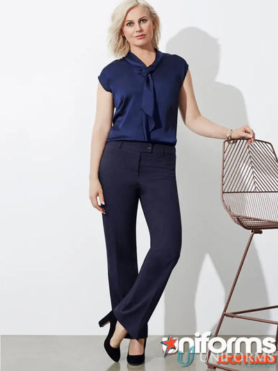 Woman in navy blue blouse and matching trousers showcasing IOP Ladies Relaxed Fit Straight Leg Pant bs29320 ladies