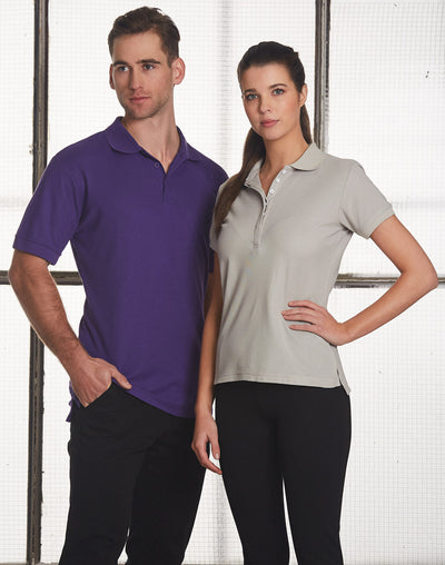 Ladies TrueDry Connection polo: man and woman in purple and gray shirts