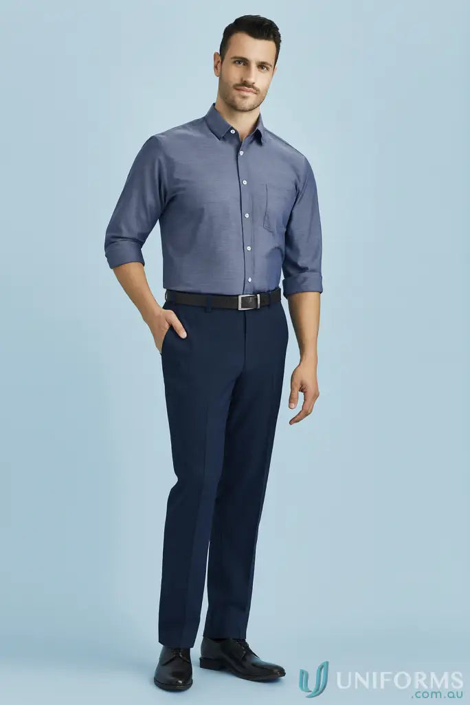 Men’s navy blue workwear shirt with rolled-up sleeves and dark tapered pants