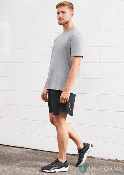 Man in athletic wear wearing Mens Tactic Shorts with mesh panels and st511m design