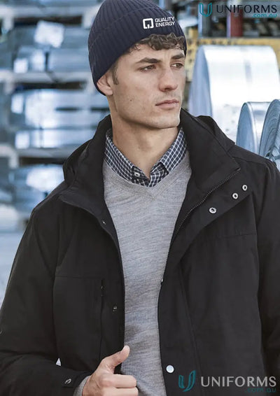 Man in streetworx beanie and winter jacket stays warm during temperature drops