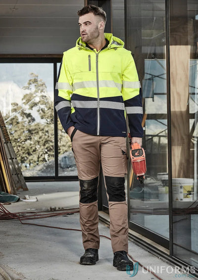 Man wearing syzmik streetworx softshell jacket, 2-in-1 stretch softshell workwear