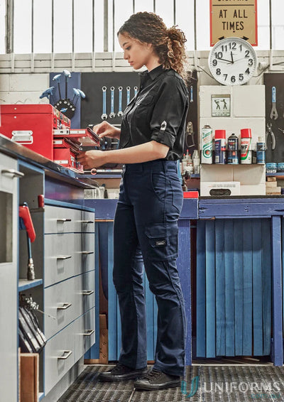 Woman in dark Syzmik women’s rugged cooling cargo pant ZP704 for tough workdays