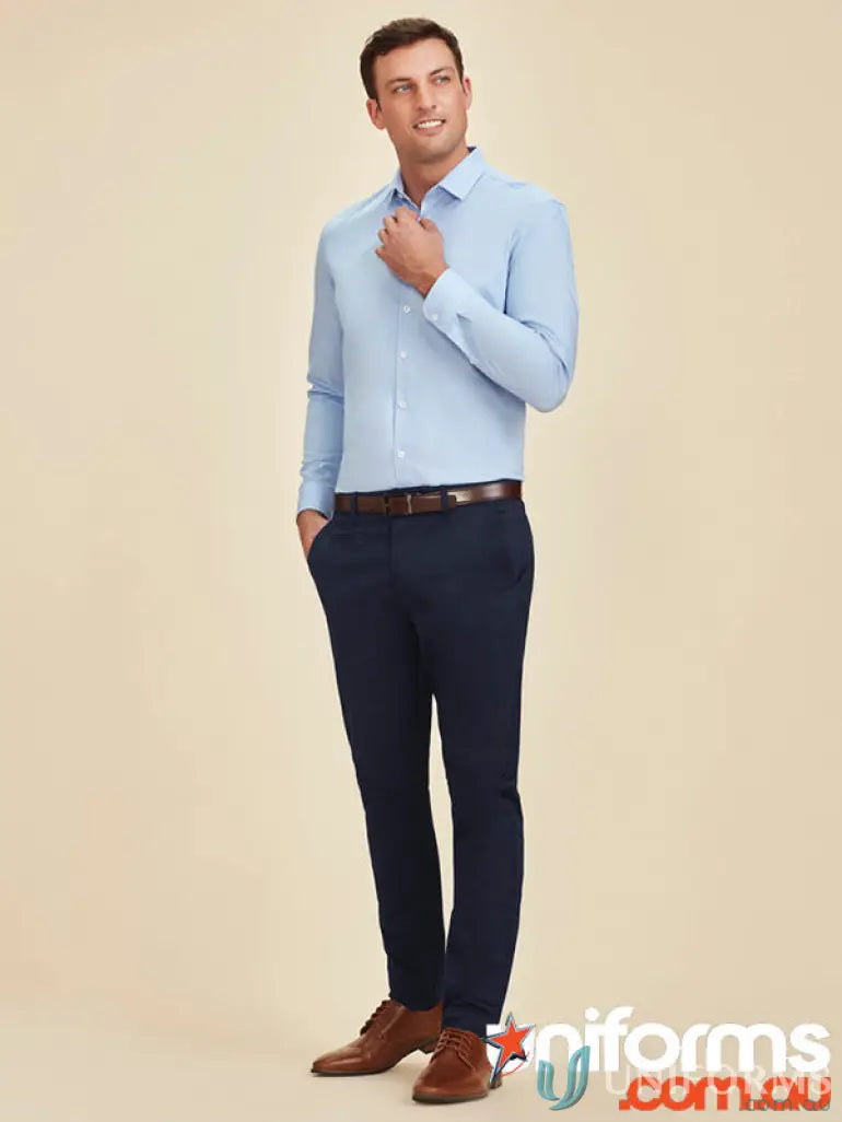Man in blue dress shirt and navy pants wearing Traveller Modern Stretch Chino Pant RGP264M