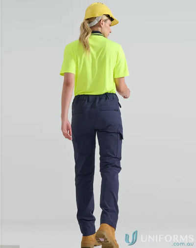 Woman modeling unisex DWR water repellent flexi work pants with hi-vis yellow polo shirt