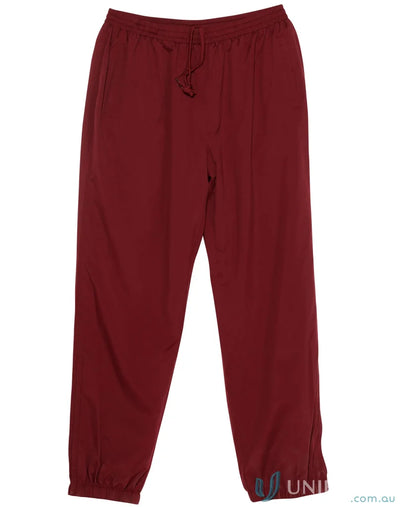 Winning Spirit Kids Legend Warm Up Pants with maroon color and zip-up leg openings
