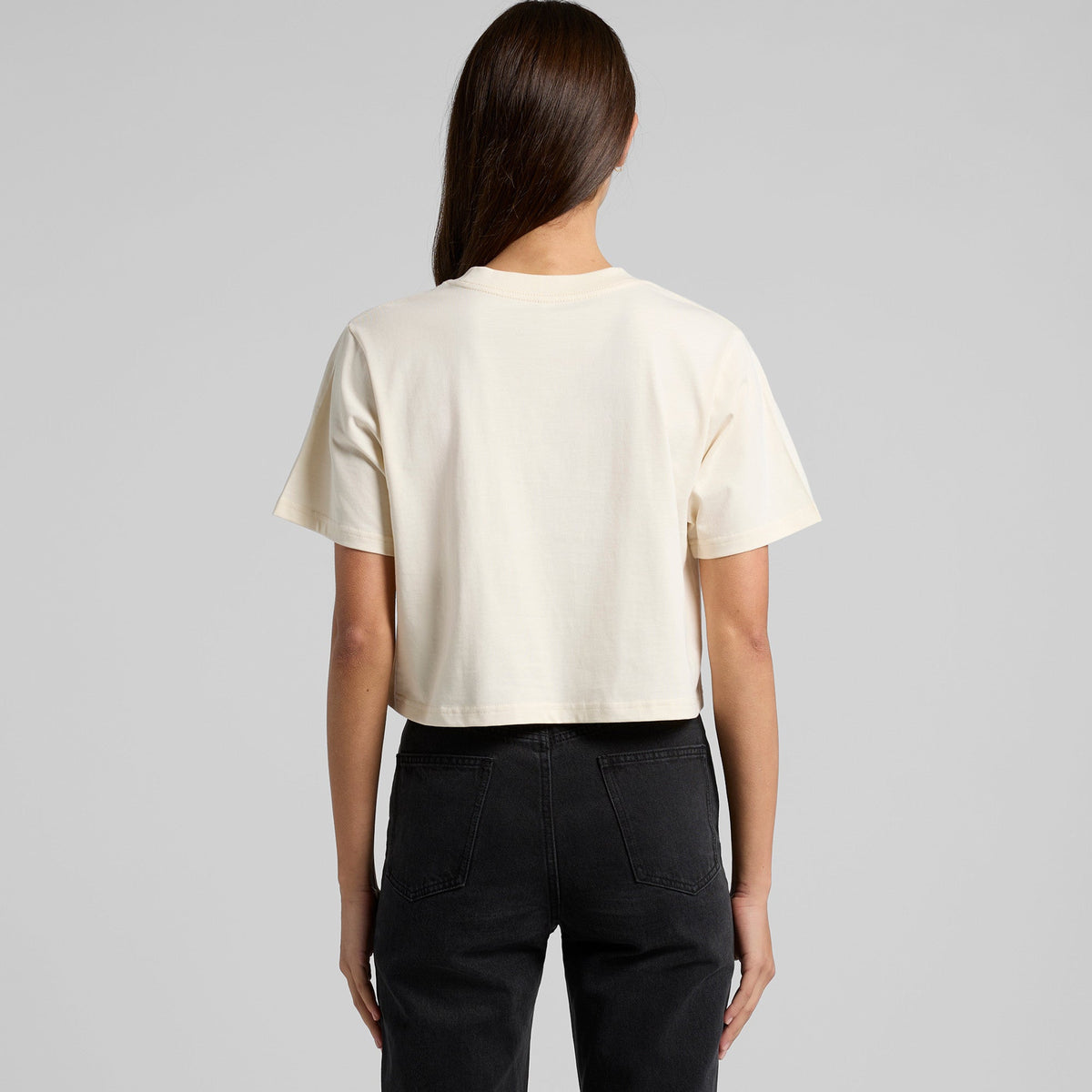Cream-colored cropped tee with short sleeves and round neckline perfect for casual workwear or stylish work uniforms