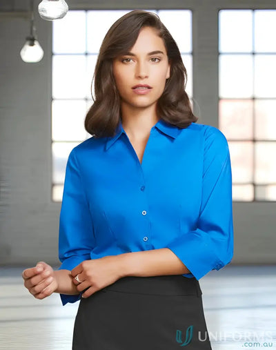 Woman wearing the YR Ladies EMB 3Q Shirt in a blue monaco shirt with french cuffs